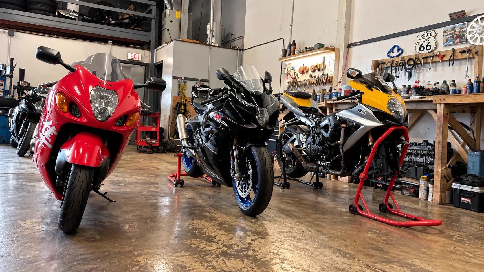 Suzuki Hayabusa and GSX-R sportbikes lined up inside TT Sport Garage, Carol Stream, IL
